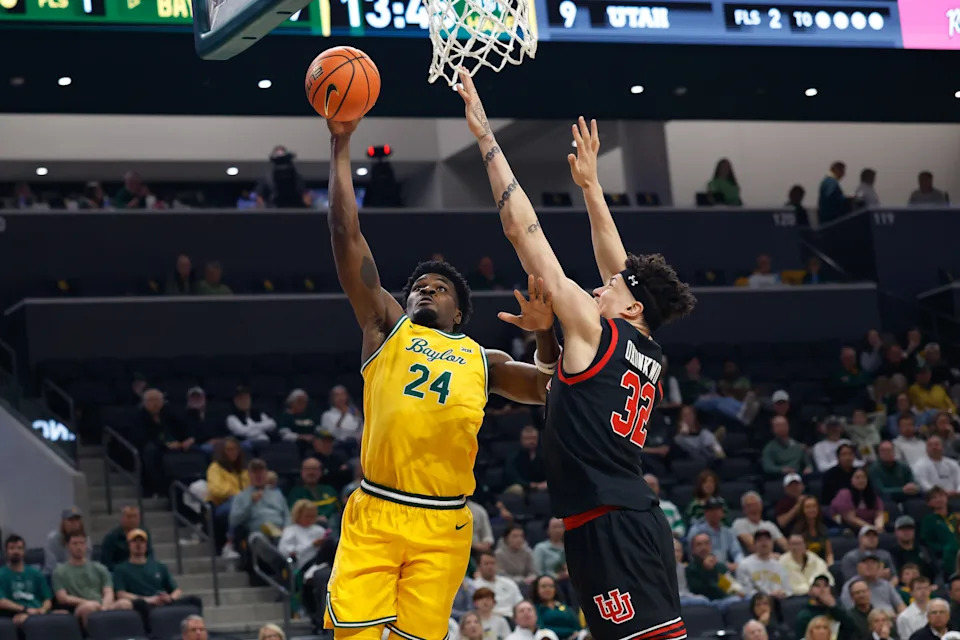 Mar 7, 2026; Waco, Texas, USA; Baylor Bears guard Tounde Yessoufou (24) scores a layup against Utah Utes forward James Okonkwo (32) during the first half at Paul and Alejandra Foster Pavilion. Mandatory Credit: Chris Jones-Imagn Images