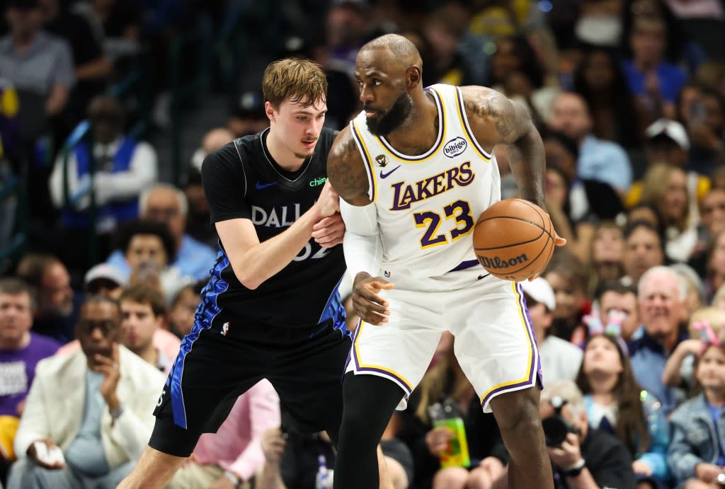 Los Angeles Lakers forward LeBron James controls the ball as Dallas Mavericks forward Cooper Flagg defends during the first half at American Airlines Center. Kevin Jairaj-Imagn Images
