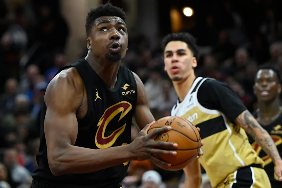 Cleveland Cavaliers center Thomas Bryant looks to the basket as Washington Wizards guard Will Riley looks on Feb. 11, 202,; in Cleveland.