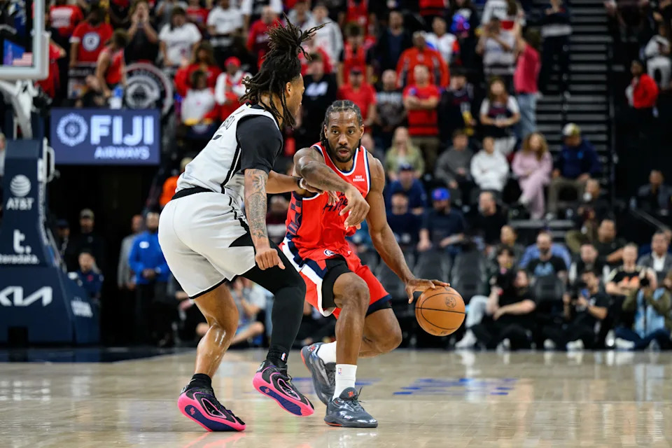 Apr 2, 2026; Inglewood, California, USA; Los Angeles Clippers forward Kawhi Leonard (2) drives the ball while under pressure from San Antonio Spurs guard Stephon Castle (5) during the first half at Intuit Dome. Mandatory Credit: William Liang-Imagn Images