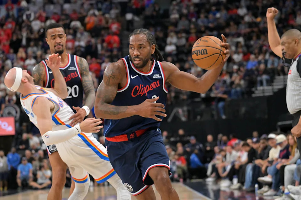 Apr 8, 2026; Inglewood, California, USA; Los Angeles Clippers forward Kawhi Leonard (2) is fouled by Oklahoma City Thunder guard Alex Caruso (9) as he drives to the basket in the first half at Intuit Dome. Mandatory Credit: Jayne Kamin-Oncea-Imagn Images