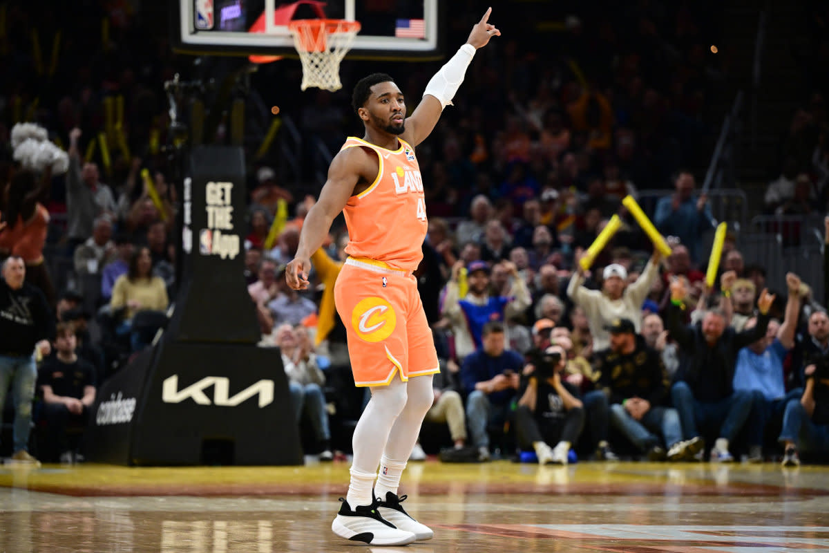 Cleveland Cavaliers guard Donovan Mitchell reacts after a basket by guard Max Strus (2) during the second half against the Orlando Magic at Rocket Arena. David Dermer-Imagn Images