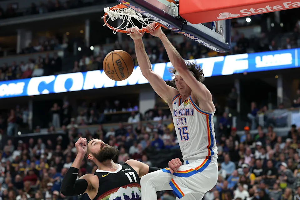 DENVER, COLORADO - APRIL 10: Branden Carlson #15 of the Oklahoma City Thunder dunks against Jonas Valanciunas #17 of the Denver Nuggets during the fourth quarter at Ball Arena on April 10, 2026 in Denver, Colorado. NOTE TO USER: User expressly acknowledges and agrees that, by downloading and or using this photograph, User is consenting to the terms and conditions of the Getty Images License Agreement. (Photo by Matthew Stockman/Getty Images)