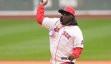 Rapper Flavor Flav threw out the first pitch before a baseball game between the Boston Red Sox and the San Diego Padres, Sunday, in Boston.