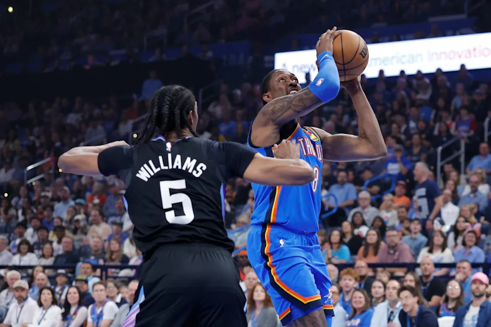 Apr 5, 2026; Oklahoma City, Oklahoma, USA; Oklahoma City Thunder guard Jalen Williams (8) goes up for a basket beside Utah Jazz forward Cody Williams (5) during the first quarter at Paycom Center. Mandatory Credit: Alonzo Adams-Imagn Images
