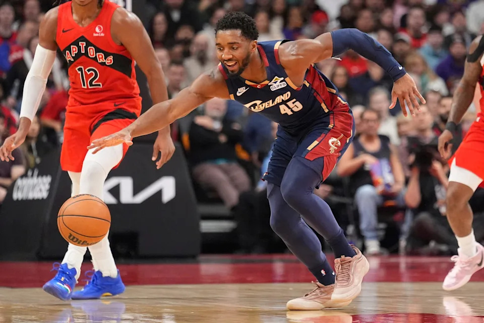 Cleveland Cavaliers guard Donovan Mitchell (45) reaches for the ball against the Toronto Raptors on Nov. 24, 2025, in Toronto, Ontario.