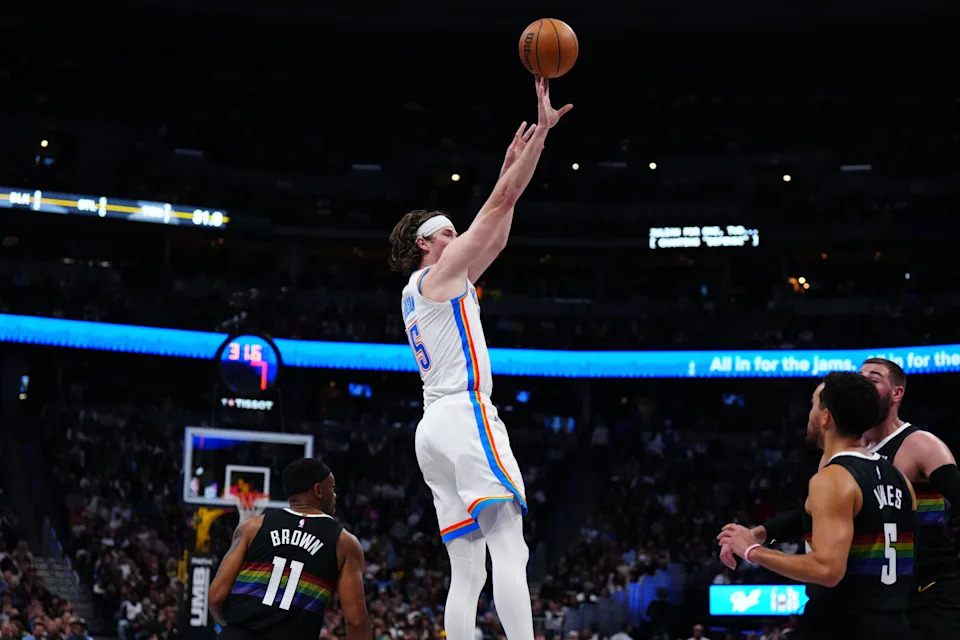 Apr 10, 2026; Denver, Colorado, USA; Oklahoma City Thunder center Branden Carlson (15) shoots the ball in the second half at Ball Arena. Mandatory Credit: Ron Chenoy-Imagn Images