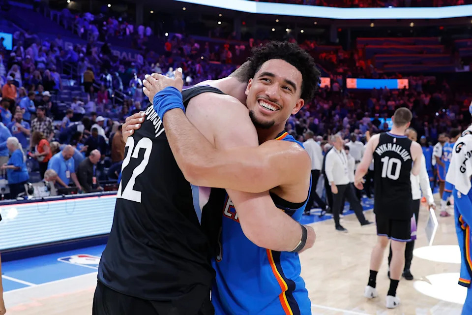 Apr 5, 2026; Oklahoma City, Oklahoma, USA; Oklahoma City Thunder guard Jared McCain (3) hugs Utah Jazz forward Kyle Filipowski (22) after their game at Paycom Center. Mandatory Credit: Alonzo Adams-Imagn Images