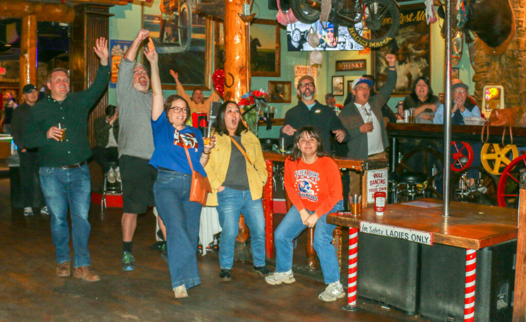 Denizens of the Rock Ledge Lodge in Golden take in a Denver Broncos playoff game in January 2026. (John Moore/Denver Gazette)