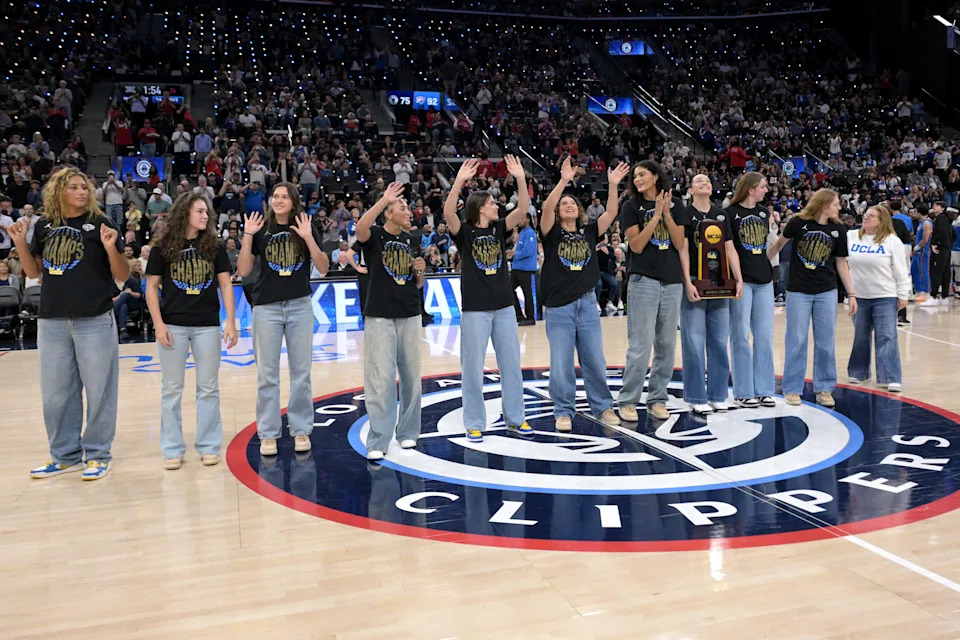 Apr 8, 2026; Inglewood, California, USA; Members of the UCLA Bruins WomenÕs National Championship basketball team waves to the crowd as they were honored during a time out at the game between the Los Angeles Clippers and the Oklahoma City Thunder at Intuit Dome. Mandatory Credit: Jayne Kamin-Oncea-Imagn Images
