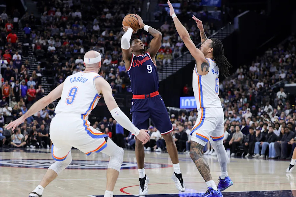 INGLEWOOD, CALIFORNIA - APRIL 08: Bennedict Mathurin #9 of the Los Angeles Clippers shoots against Alex Caruso #9 and Jaylin Williams #6 of the Oklahoma City Thunder during the first half of an NBA game at Intuit Dome on April 08, 2026 in Inglewood, California. NOTE TO USER: User expressly acknowledges and agrees that, by downloading and or using this photograph, User is consenting to the terms and conditions of the Getty Images License Agreement. (Photo by Ryan Sirius Sun/Getty Images)