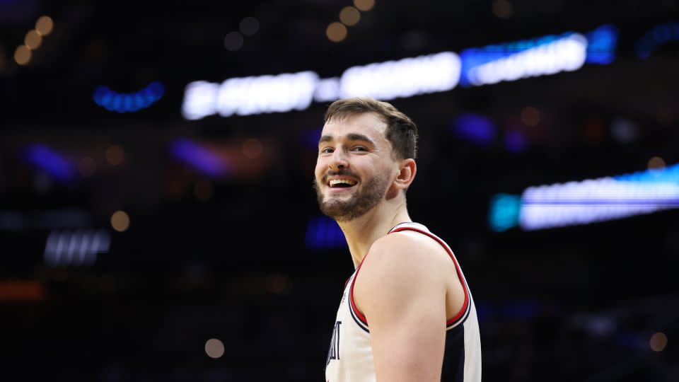 UConn Huskies forward Alex Karaban celebrates after defeating the UCLA Bruins 73-57 in the second round of the 2026 NCAA Tournament on March 22. - Emilee Chinn/Getty Images