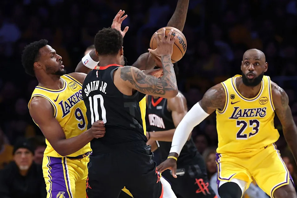 Bronny James (left), Jabari Smith Jr. (center) and LeBron James (right) during the April 18 NBA game.Credit: Sean M. Haffey/Getty