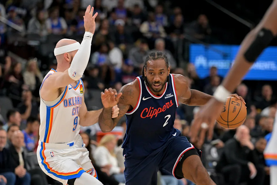 Apr 8, 2026; Inglewood, California, USA; Los Angeles Clippers forward Kawhi Leonard (2) is defended by Oklahoma City Thunder guard Alex Caruso (9) as he drives to the basket in the first half at Intuit Dome. Mandatory Credit: Jayne Kamin-Oncea-Imagn Images
