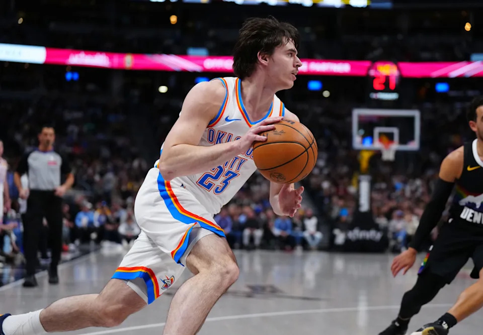 Apr 10, 2026; Denver, Colorado, USA; Oklahoma City Thunder forward Brooks Barnhizer (23) controls the ball in the first quarter against the Denver Nuggets at Ball Arena. Mandatory Credit: Ron Chenoy-Imagn Images