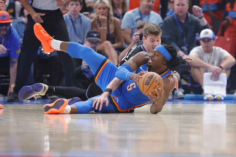 Apr 5, 2026; Oklahoma City, Oklahoma, USA; Utah Jazz forward Kyle Filipowski (22) and Oklahoma City Thunder guard Luguentz Dort (5) fight for a loose ball during the first quarter at Paycom Center. Mandatory Credit: Alonzo Adams-Imagn Images