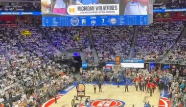 Respect for the national champions 〽️ The 2025-26 Michigan Wolverines men's basketball team gets an ovation from the Little Caesars Arena crowd during the Detroit Pistons' Game 2 showdown against the Orlando Magic on April 22, 2026. 📹 Video by Marlowe Alter, DFP. #michigan #wolverines #basketball #pistons