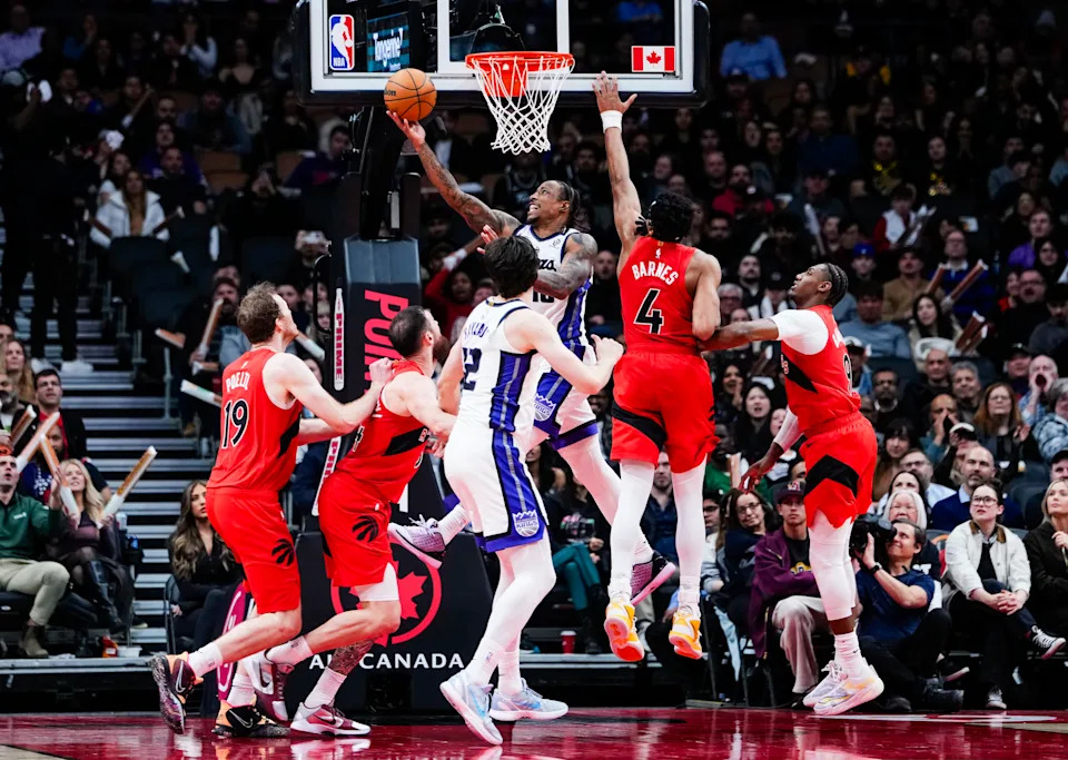 TORONTO, CANADA - APRIL 1: DeMar DeRozan #10 of the Sacramento Kings goes to the basket against Scottie Barnes #4 of the Toronto Raptors in their NBA game at Scotiabank Arena on April 1, 2026 in Toronto, Ontario, Canada. NOTE TO USER: User expressly acknowledges and agrees that, by downloading and/or using this Photograph, user is consenting to the terms and conditions of the Getty Images License Agreement. (Photo by Mark Blinch/Getty Images)