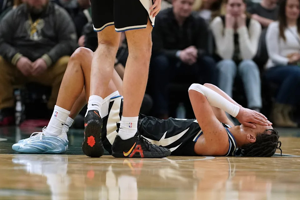 Milwaukee Bucks' Ousmane Dieng reacts after suffering an injury during the second half of an NBA basketball game against the Boston Celtics, Friday, April 3, 2026, in Milwaukee. Dieng did not return to the game.(AP Photo/Aaron Gash)