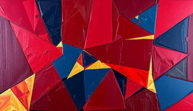 A fragmented, geometric painting depicting a Cavaliers basketball game, with sharp planes of red, blue, and gold overlapping to create a dynamic, abstract composition.