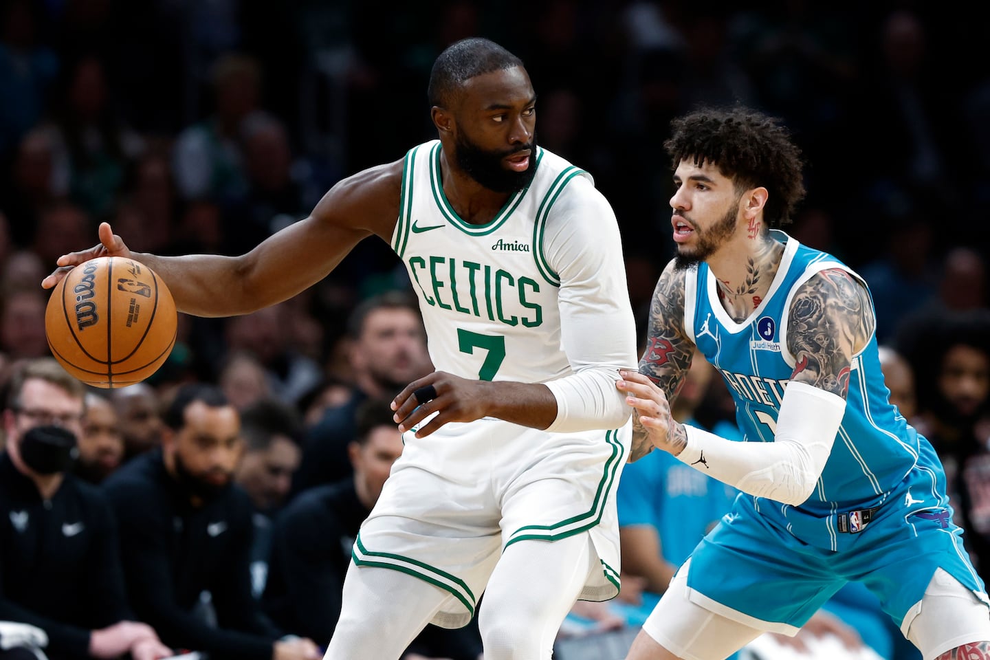 Celtics guard Jaylen Brown, who had 35 points, looks to make his move against Hornets guard LaMelo Ball during the first quarter of Tuesday night's 113-102 victory at TD Garden.