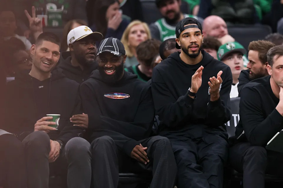 Apr 12, 2026; Boston, Massachusetts, USA; Boston Celtics forward Jayson Tatum (0) and Boston Celtics forward Jaylen Brown (7) react during the first half against the Orlando Magic at TD Garden. Mandatory Credit: Paul Rutherford-Imagn Images