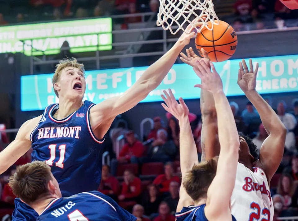 Belmont's Drew Scharnowski (11) blocks a shot by Bradley's Jaquan Johnson in the second half of their college basketball game Monday, Feb. 9, 2026 at Carver Arena in Peoria. Johnson was fouled before the block. The Braves defeated the Bruins 95-84.