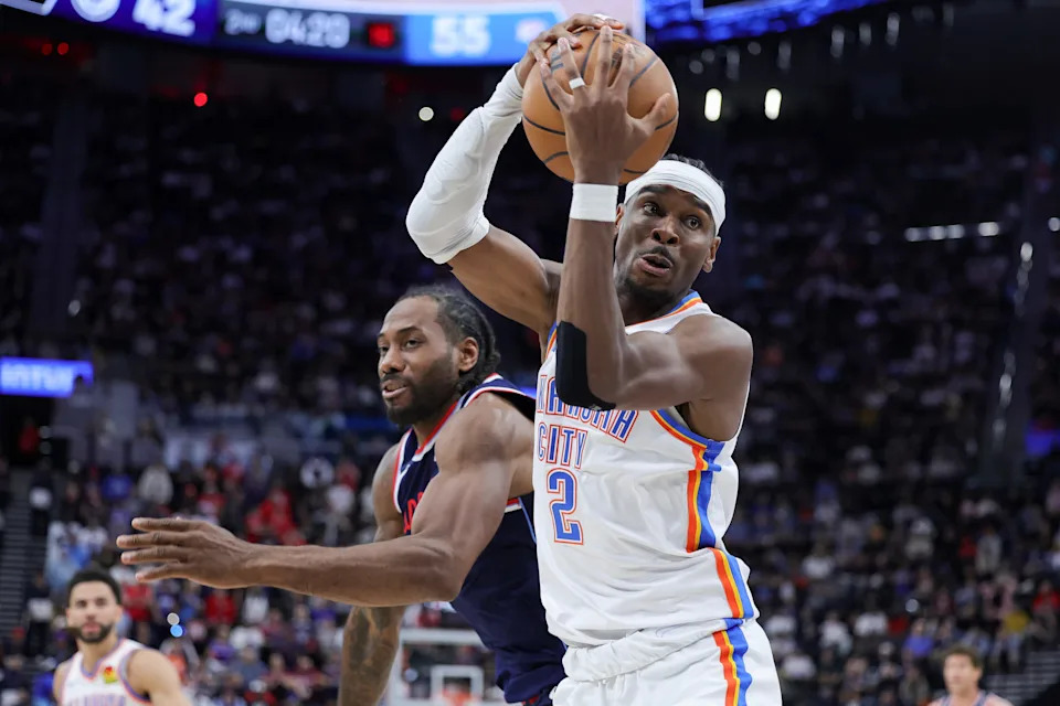 INGLEWOOD, CALIFORNIA - APRIL 08: Shai Gilgeous-Alexander #2 of the Oklahoma City Thunder and Kawhi Leonard #2 of the Los Angeles Clippers vie for the ball during the first half of an NBA game at Intuit Dome on April 08, 2026 in Inglewood, California. NOTE TO USER: User expressly acknowledges and agrees that, by downloading and or using this photograph, User is consenting to the terms and conditions of the Getty Images License Agreement. (Photo by Ryan Sirius Sun/Getty Images)