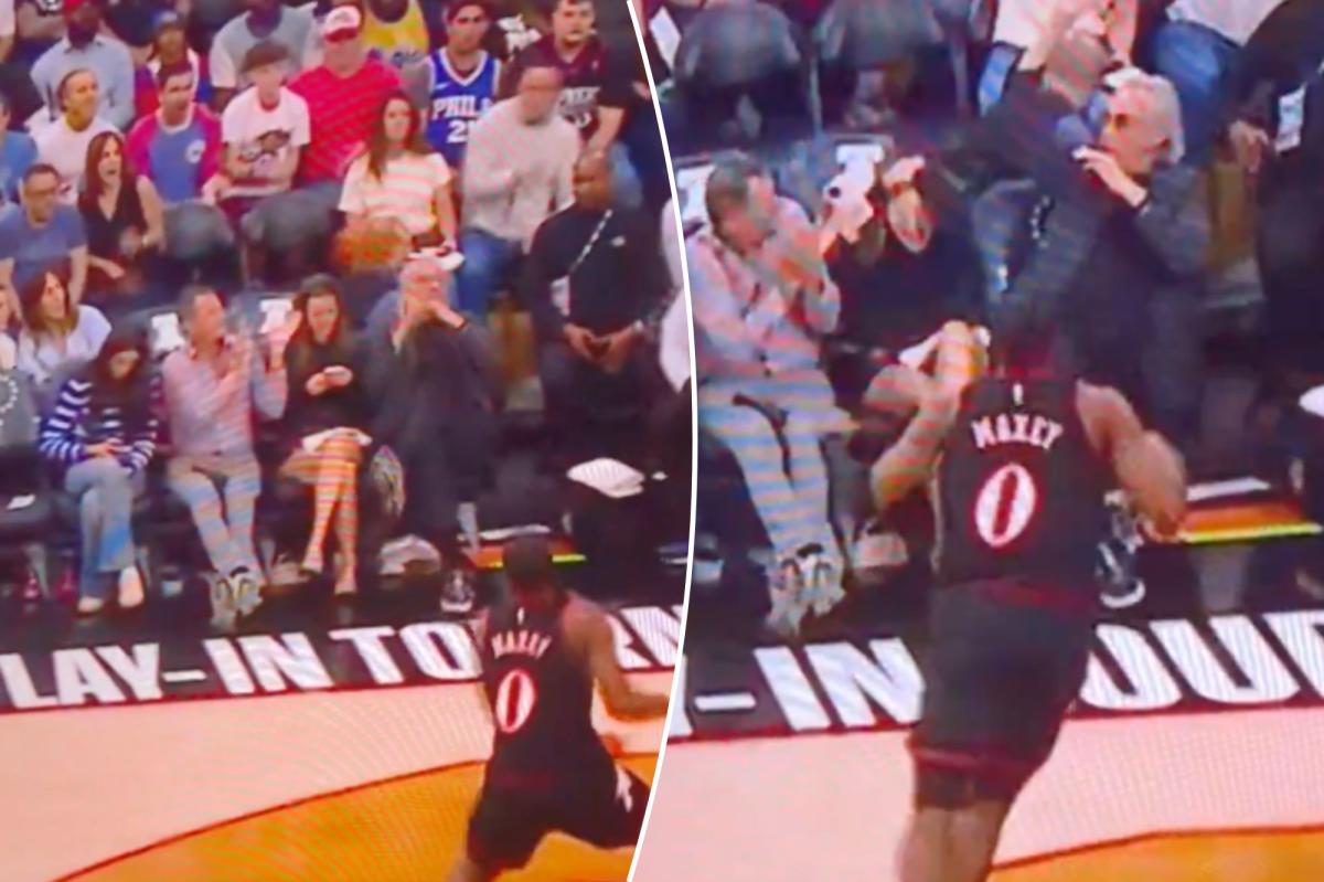 76ers fan pays painful price for staring at phone from front row during play-in game