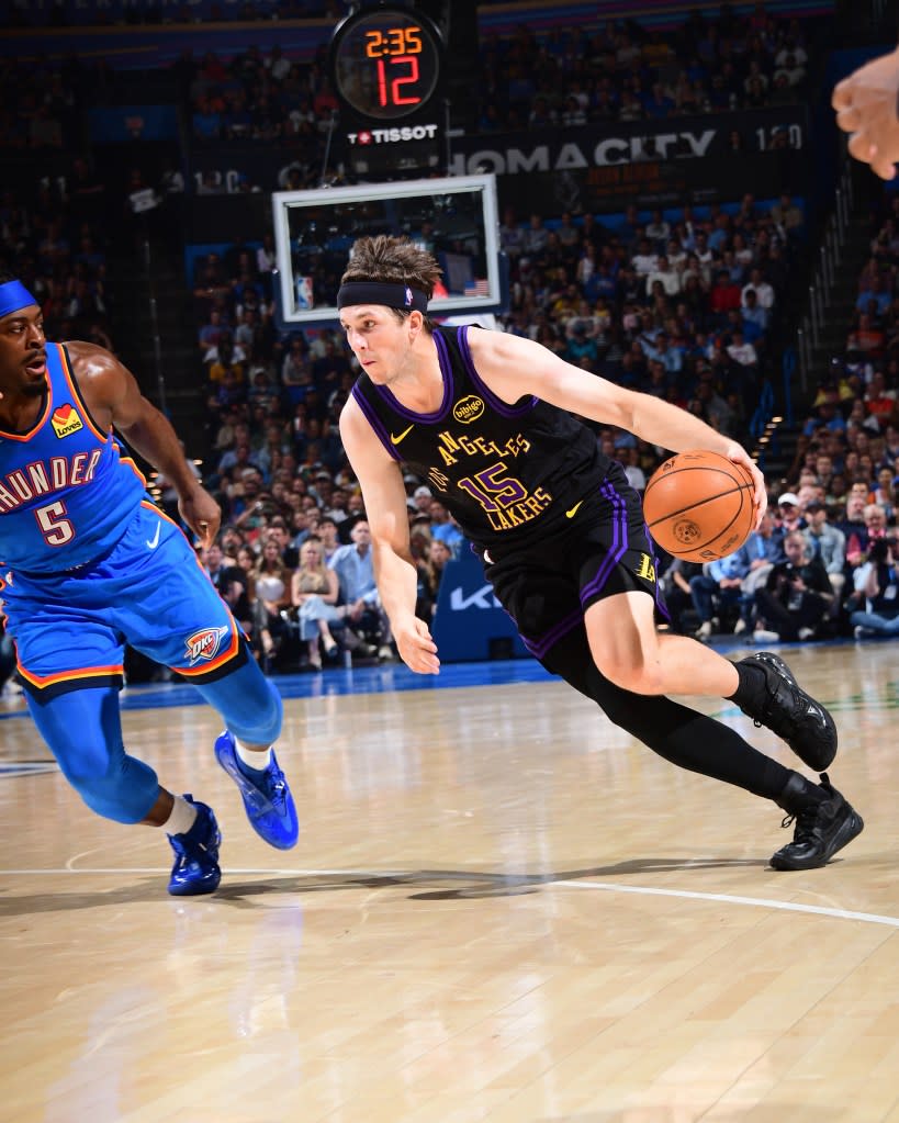 Austin Reaves of the Los Angeles Lakers drives to the basket during the game against the Oklahoma City Thunder on April 2, 2026 at Paycom Center in Oklahoma City, Oklahoma. (Photo by Adam Pantozzi/NBAE via Getty Images) NBAE via Getty Images