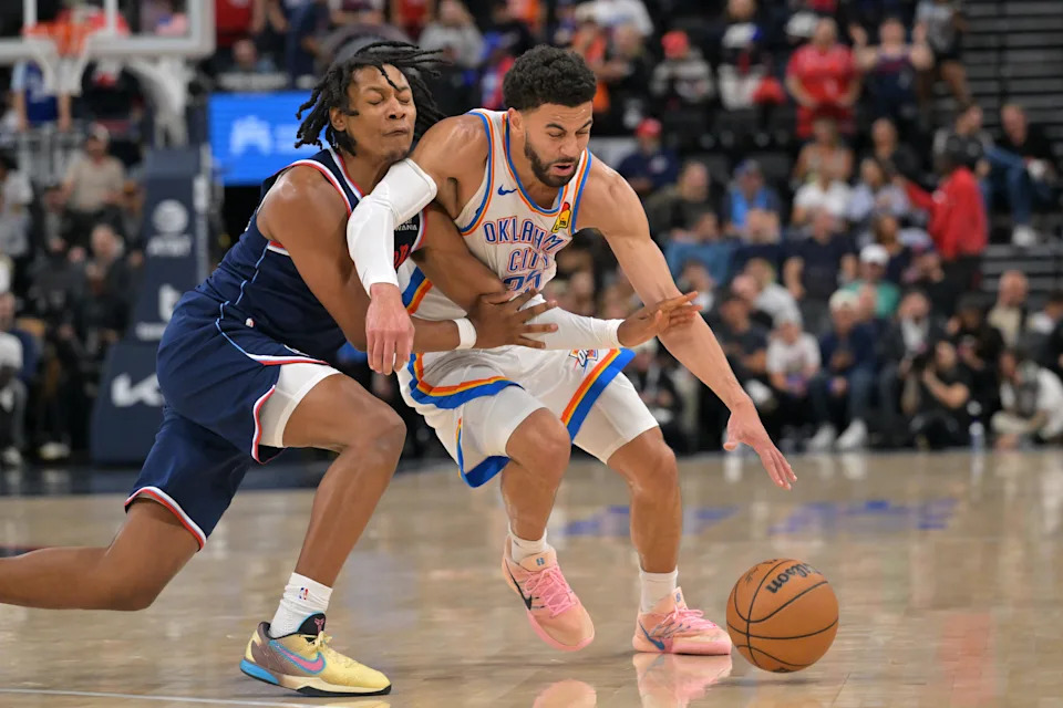Apr 8, 2026; Inglewood, California, USA; Los Angeles Clippers guard Tyty Washington Jr. (15) defends Oklahoma City Thunder guard Ajay Mitchell (25) in the second half at Intuit Dome. Mandatory Credit: Jayne Kamin-Oncea-Imagn Images
