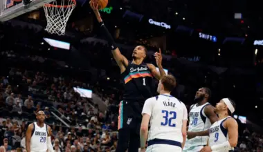 Victor Wembanyama scores on the Dallas Mavericks in the second half at Frost Bank Center on April 10.