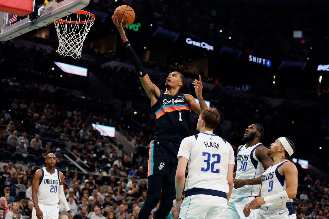 Victor Wembanyama scores on the Dallas Mavericks in the second half at Frost Bank Center on April 10.