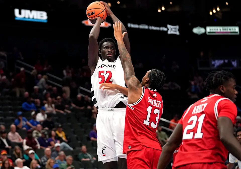 Cincinnati Bearcats center Moustapha Thiam (52) makes a basket from two point range in the second half of the Phillips 66 Big 12 Menâ€™s Basketball Tournament between the Cincinnati Bearcats and Utah Utes, Tuesday, March 10, 2026, at T-Mobile Center in Kansas City, MO. Bearcats won 73-66.
