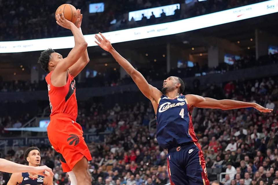 Cavaliers forward Evan Mobley defends Raptors guard Scottie Barnes during the first half, Nov. 24, 2025, in Toronto.
