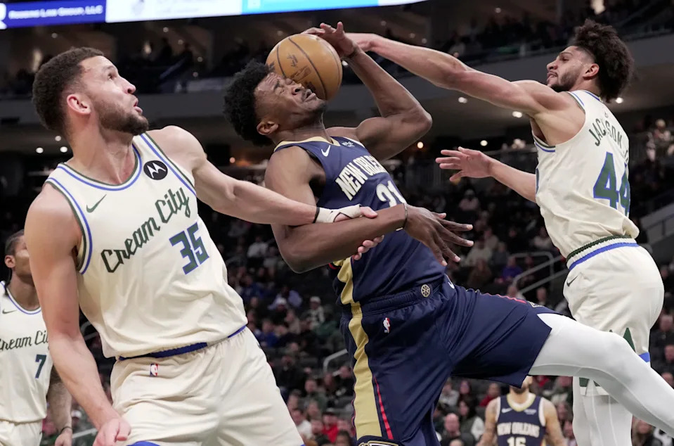 New Orleans Pelicans center Yves Missi (21) is swarmed by Milwaukee Bucks forward Pete Nance (35) and guard Andre Jackson Jr. (44) during the first half of their game Wednesday, February 4, 2026 at Fiserv Forum in Milwaukee, Wisconsin.