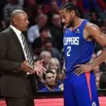 Los Angeles Clippers head coach Doc Rivers talks to Clippers forward Kawhi Leonard (2) as he leaves the game against the New Orleans Pelicans in the fourth quarter at Staples Center.