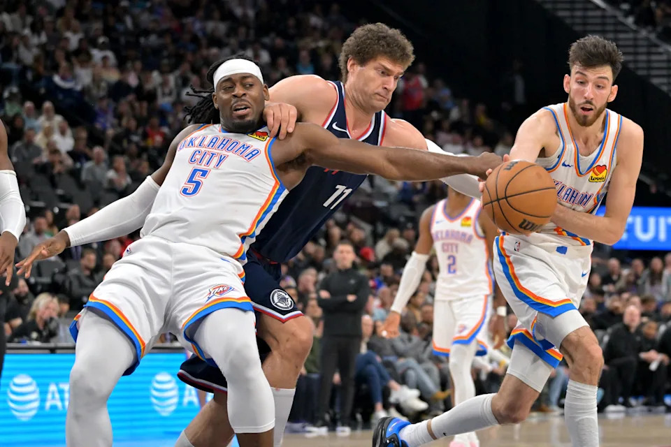 Apr 8, 2026; Inglewood, California, USA; Oklahoma City Thunder guard Luguentz Dort (5), Los Angeles Clippers center Brook Lopez (11) and Oklahoma City Thunder center Chet Holmgren (7) battle for a loose ball in the second half at Intuit Dome. Mandatory Credit: Jayne Kamin-Oncea-Imagn Images