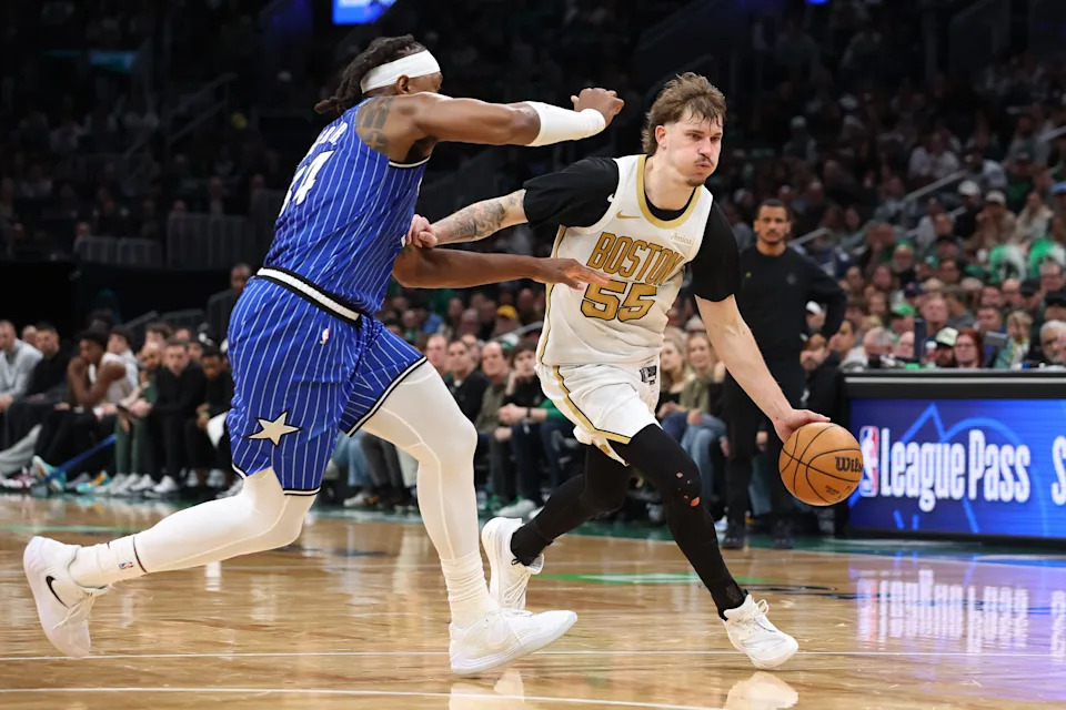 Apr 12, 2026; Boston, Massachusetts, USA; Boston Celtics guard Baylor Scheierman (55) drives to the basket during the second half against the Orlando Magic at TD Garden. Mandatory Credit: Paul Rutherford-Imagn Images