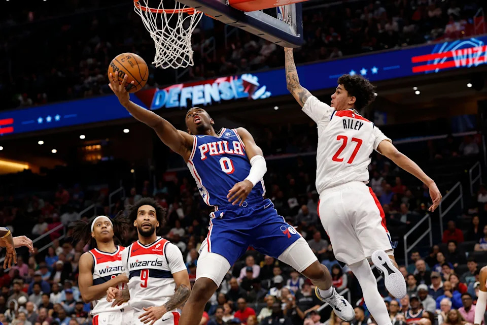 Apr 1, 2026; Washington, District of Columbia, USA; Philadelphia 76ers guard Tyrese Maxey (0) shoots the ball as Washington Wizards guard Will Riley (27) defends in the first halfat Capital One Arena. Mandatory Credit: Geoff Burke-Imagn Images