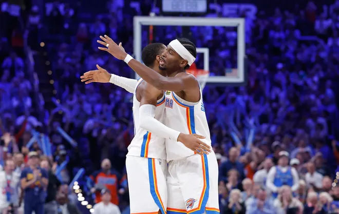Oct 28, 2025; Oklahoma City, Oklahoma, USA; Oklahoma City Thunder guard Shai Gilgeous-Alexander (2) goes over to hug guard Aaron Wiggins (21) after a play against Sacramento Kings during the second half at Paycom Center. Mandatory Credit: Alonzo Adams-Imagn Images