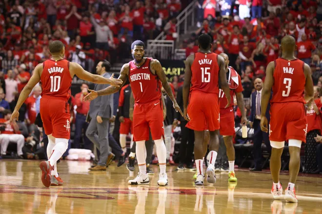 May 10, 2019; Houston, TX, USA; Houston Rockets guard Iman Shumpert (1) guard Eric Gordon (10) center Clint Capela (15) and guard Chris Paul (3) walk off the court during a Golden State Warriors timeout in game six of the second round of the 2019 NBA Playoffs at Toyota Center. Mandatory Credit: Thomas B. Shea-USA TODAY Sports