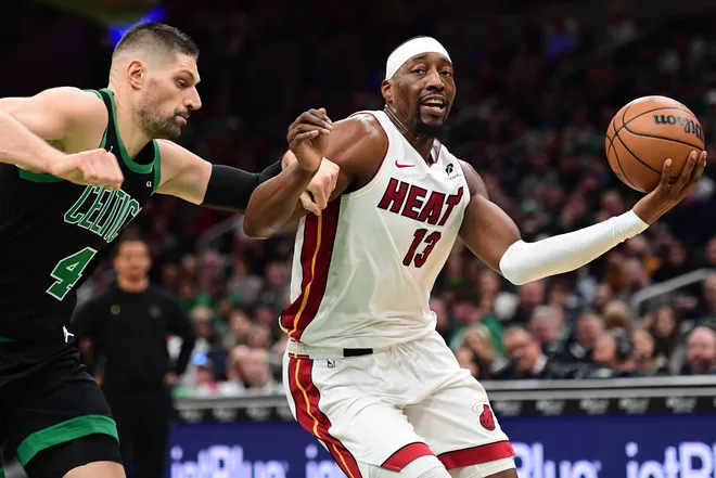 Feb 6, 2026; Boston, Massachusetts, USA; Boston Celtics center Nikola Vucevic defends Miami Heat center Bam Adebayo (13) during the first half at TD Garden. Mandatory Credit: Bob DeChiara-Imagn Images