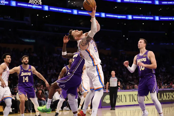 Feb 9, 2026; Los Angeles, California, USA; Oklahoma City Thunder center Isaiah Hartenstein (55) shoots the ball as he is fouled by Los Angeles Lakers forward Jarred Vanderbilt (2) during the second quarter at Crypto.com Arena. Mandatory Credit: Kiyoshi Mio-Imagn Images