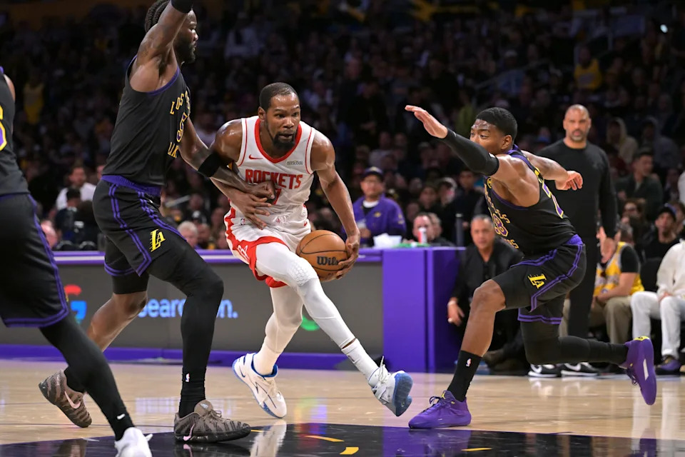 Apr 21, 2026; Los Angeles, California, USA; Houston Rockets forward Kevin Durant (7) is defended by Los Angeles Lakers center Deandre Ayton (5) as he drives to the basket during the second half of game two of the first round of the 2026 NBA Playoffs at Crypto.com Arena. Mandatory Credit: Jayne Kamin-Oncea-Imagn Images