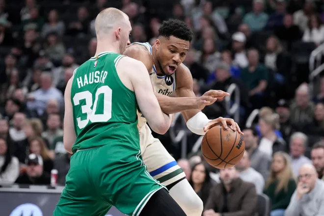 Mar 2, 2026; Milwaukee, Wisconsin, USA; Milwaukee Bucks forward Giannis Antetokounmpo (34) drives against Boston Celtics forward Sam Hauser (30) in the first half at Fiserv Forum. Mandatory Credit: Michael McLoone-Imagn Images