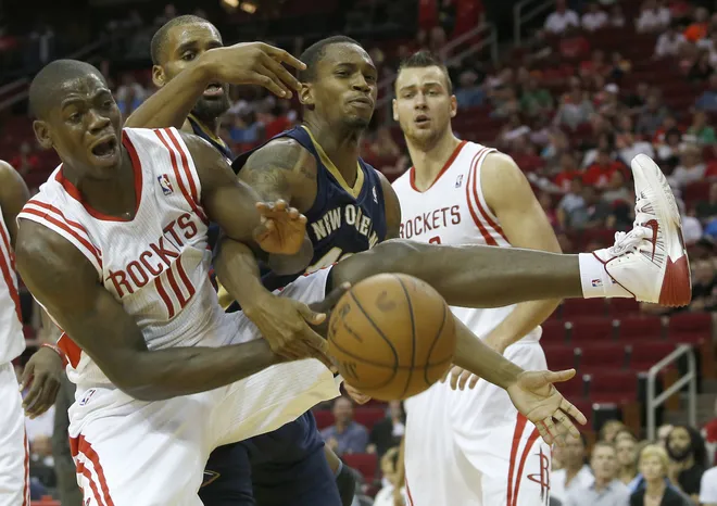HOUSTON, TX - OCTOBER 05: Ronnie Brewer #10 of the Houston Rockets and Lance Thomas #42 of the New Orleans Pelicans battle for a rebound in a preseason NBA game on October 5, 2013 at Toyota Center in Houston, Texas. The Pelicans won 116-115. NOTE TO USER: User expressly acknowledges and agrees that, by downloading and or using this photograph, User is consenting to the terms and conditions of the Getty Images License Agreement. (Photo by Thomas B. Shea/Getty Images)