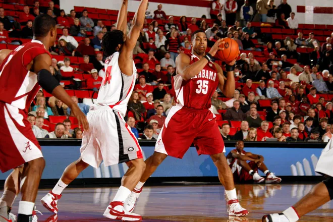 January 16, 2008; Athens, GA, USA; Alabama Crimson Tide forward (35) Richard Hendrix handles the ball in the lane against the defense of Georgia Bulldogs forward (34) Albert Jackson in the first half at Stegeman Coliseum. Mandatory Credit: Dale Zanine USA TODAY Sports