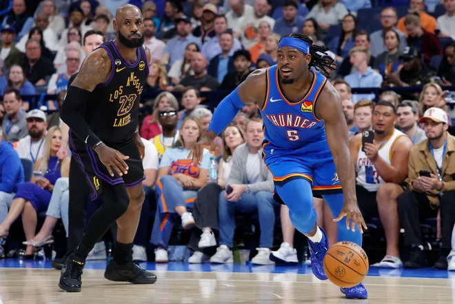 Apr 2, 2026; Oklahoma City, Oklahoma, USA; Oklahoma City Thunder guard Luguentz Dort (5) drives past Los Angeles Lakers forward LeBron James (23) during the second half at Paycom Center. Mandatory Credit: Alonzo Adams-Imagn Images