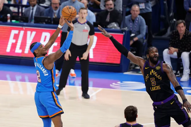 Apr 2, 2026; Oklahoma City, Oklahoma, USA; Oklahoma City Thunder guard Shai Gilgeous-Alexander (2) shoots as Los Angeles Lakers center Deandre Ayton (5) defends during the second quarter at Paycom Center. Mandatory Credit: Alonzo Adams-Imagn Images